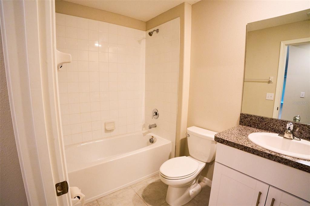 13351 Willow Bluestar Loop Riverview, FL 33579 - Photo 13 of 15 a bathroom with a sink toilet and shower