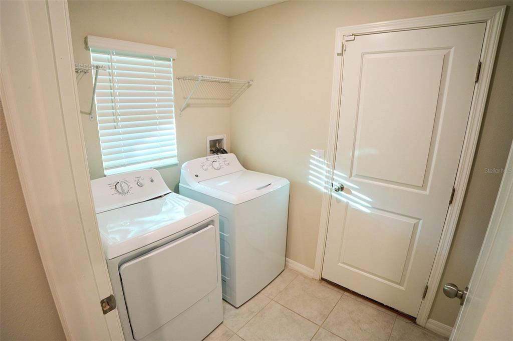 13351 Willow Bluestar Loop Riverview, FL 33579 - Photo 7 of 15 a utility room with dryer and washer