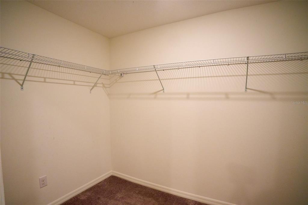 13351 Willow Bluestar Loop Riverview, FL 33579 - Photo 10 of 15 a view of a room with racks on the wall