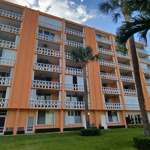 front view of building with a yard