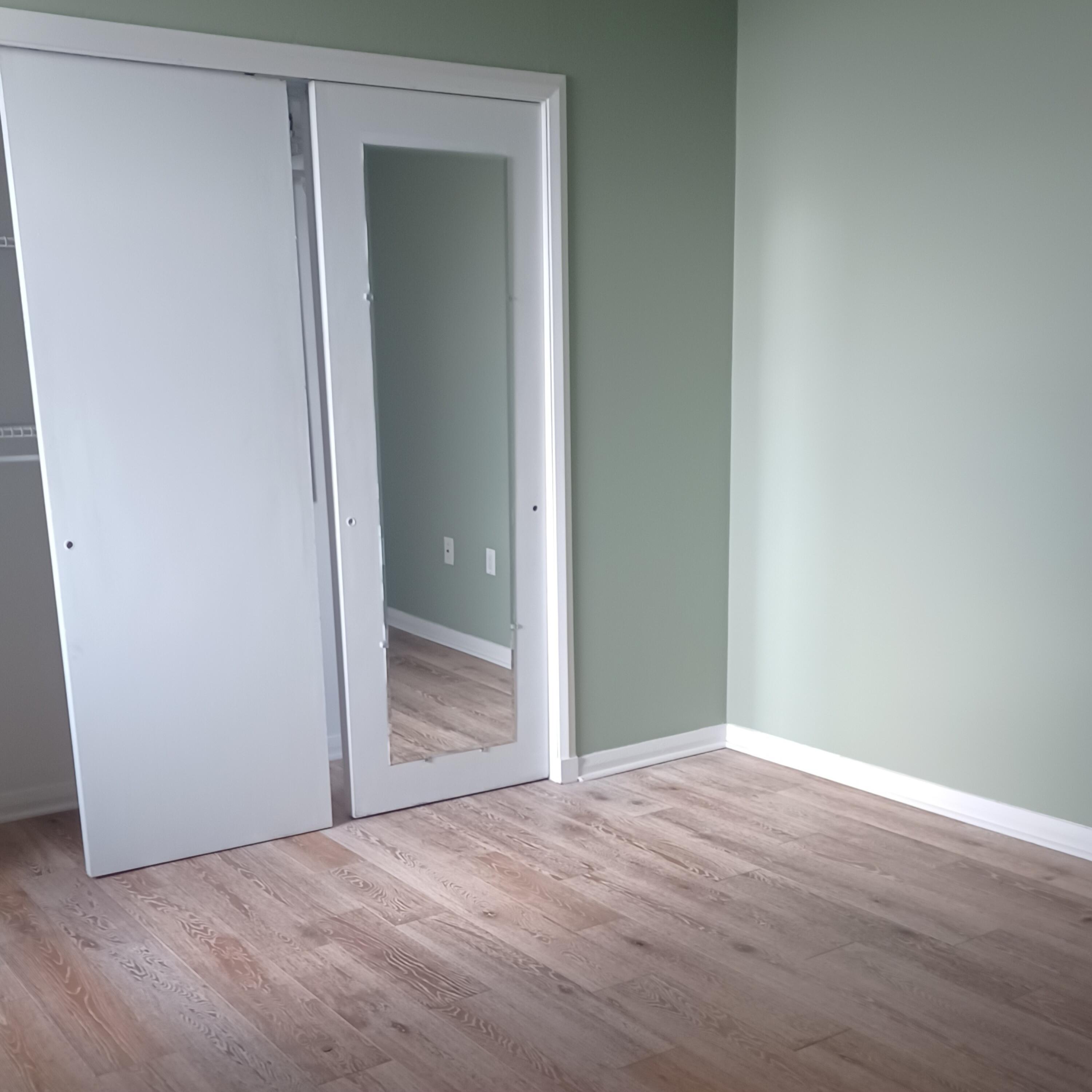 15 South Golfview Road, Unit 303 Lake Worth Beach, FL 33460 - Photo 6 of 10 a view of an empty room with wooden floor