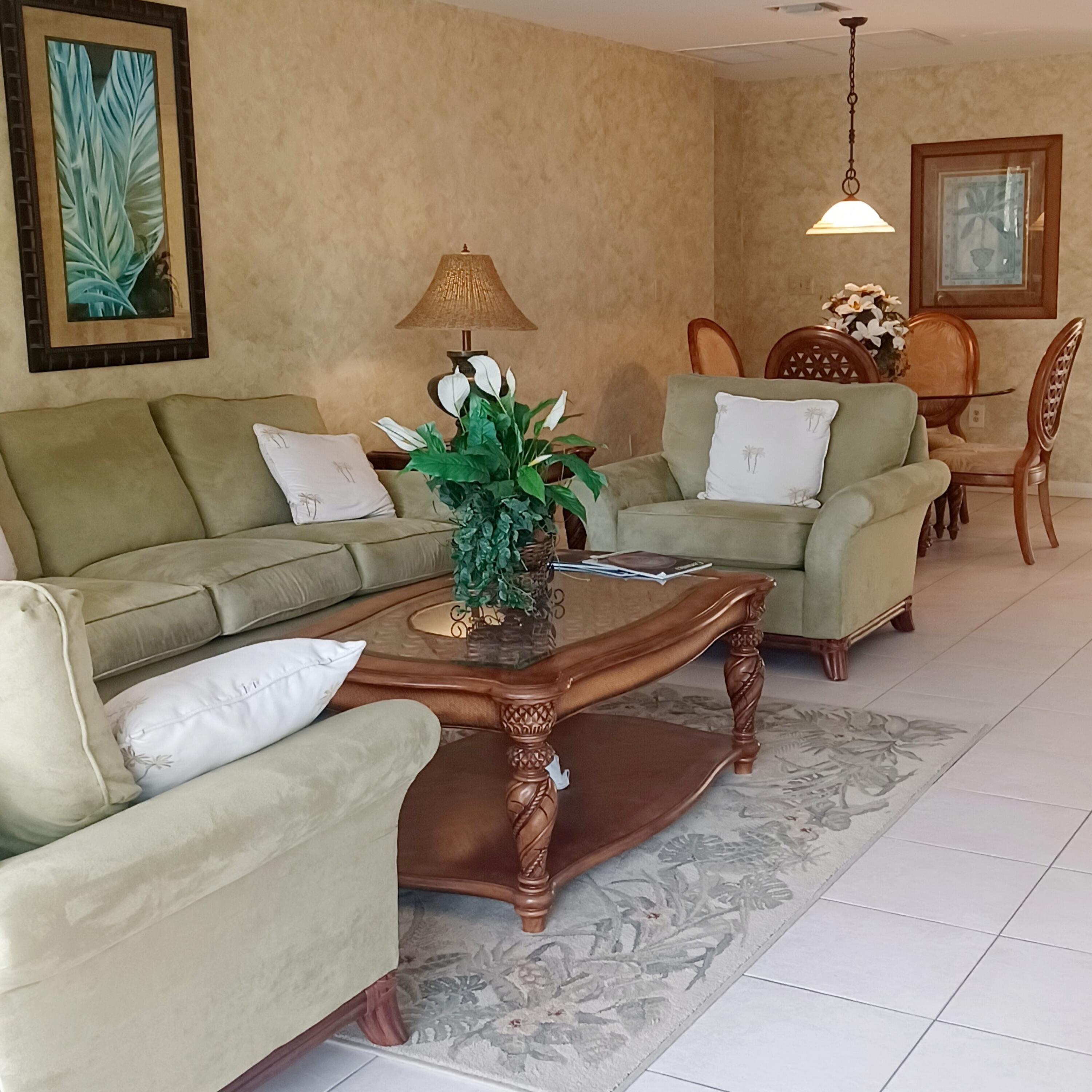15 South Golfview Road, Unit 303 Lake Worth Beach, FL 33460 - Photo 10 of 10 a living room with furniture flowerpot and a lamp