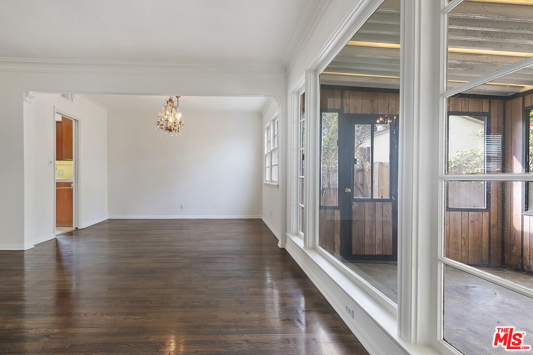 11357 Gladwin Street Los Angeles, CA 90049 - Photo 4 of 15 a view of a hallway with wooden floor and staircase