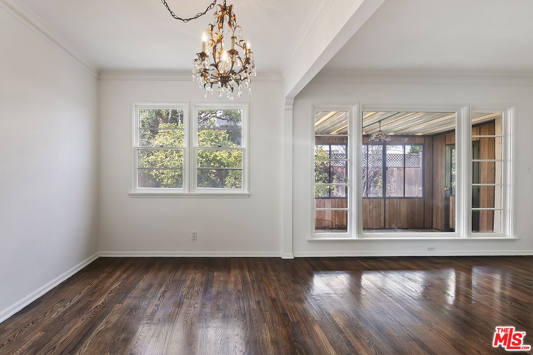 11357 Gladwin Street Los Angeles, CA 90049 - Photo 5 of 15 wooden floor in an empty room with a window