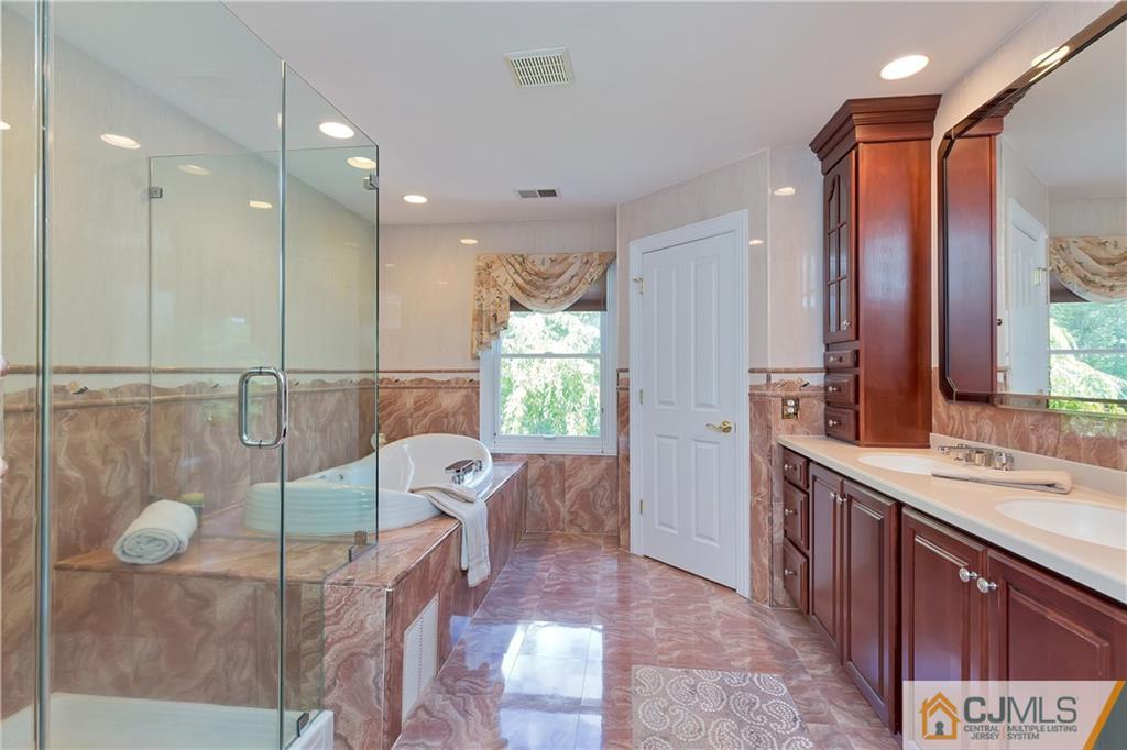 92 Union Valley Road Monroe Township, NJ 08831 - Photo 17 of 23 a bathroom with a sink mirror and vanity