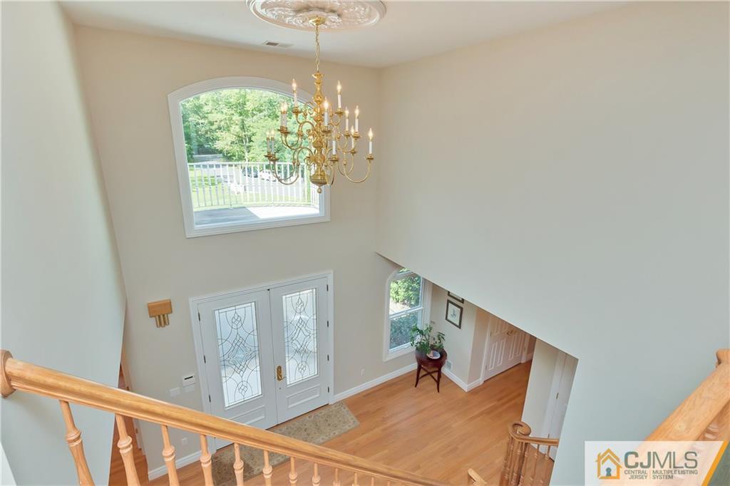 92 Union Valley Road Monroe Township, NJ 08831 - Photo 3 of 23 a view of a hallway with windows and chandelier