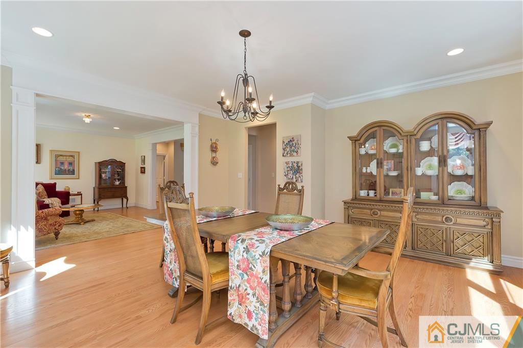 92 Union Valley Road Monroe Township, NJ 08831 - Photo 6 of 23 a view of a dining room with furniture and wooden floor