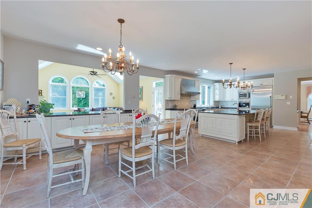 92 Union Valley Road Monroe Township, NJ 08831 - Photo 7 of 23 a view of a dining room with furniture and a chandelier