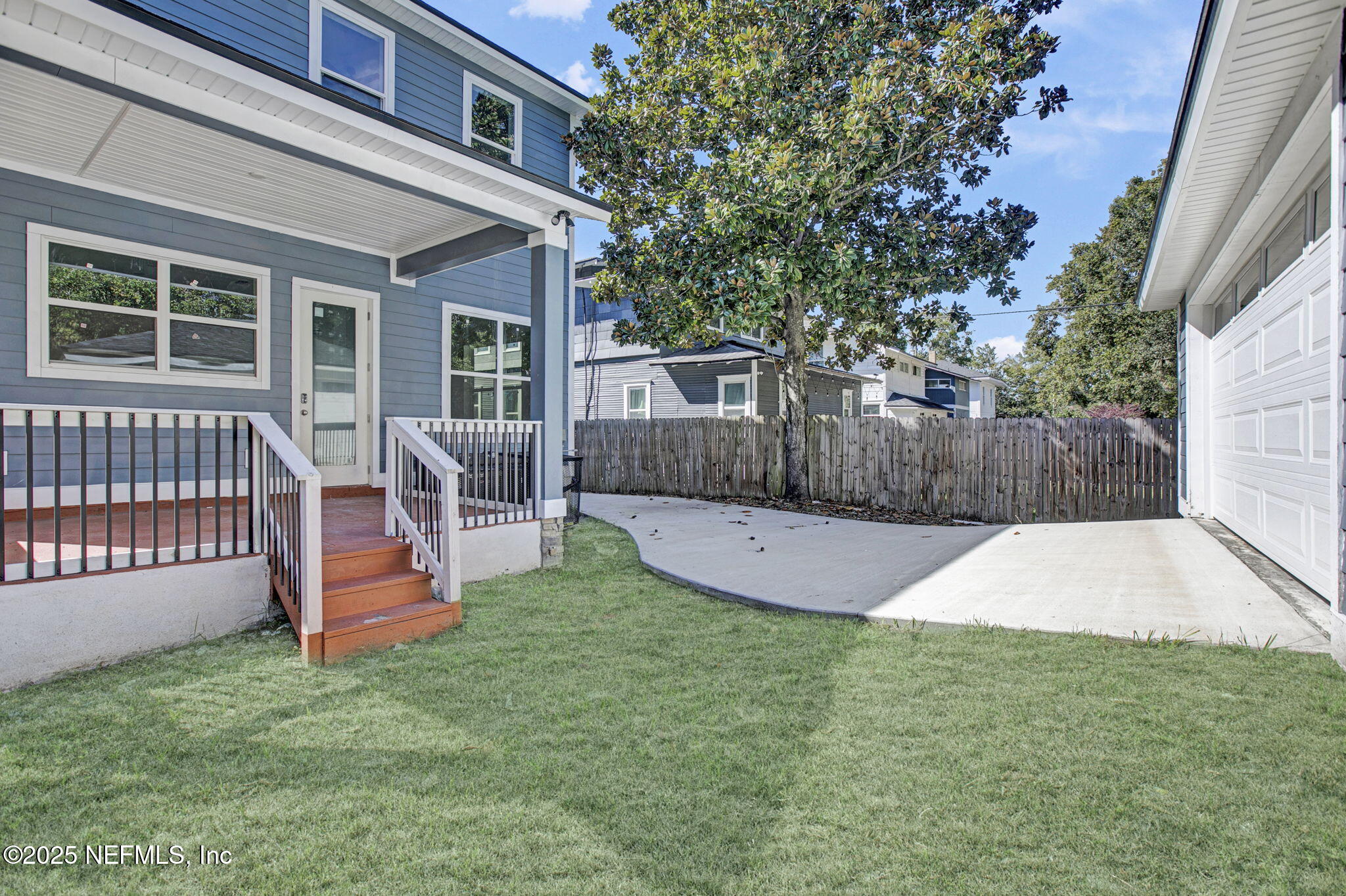 2841 Post Street Jacksonville, FL 32205 - Photo 15 of 40 a view of a backyard with a small cabin and wooden fence