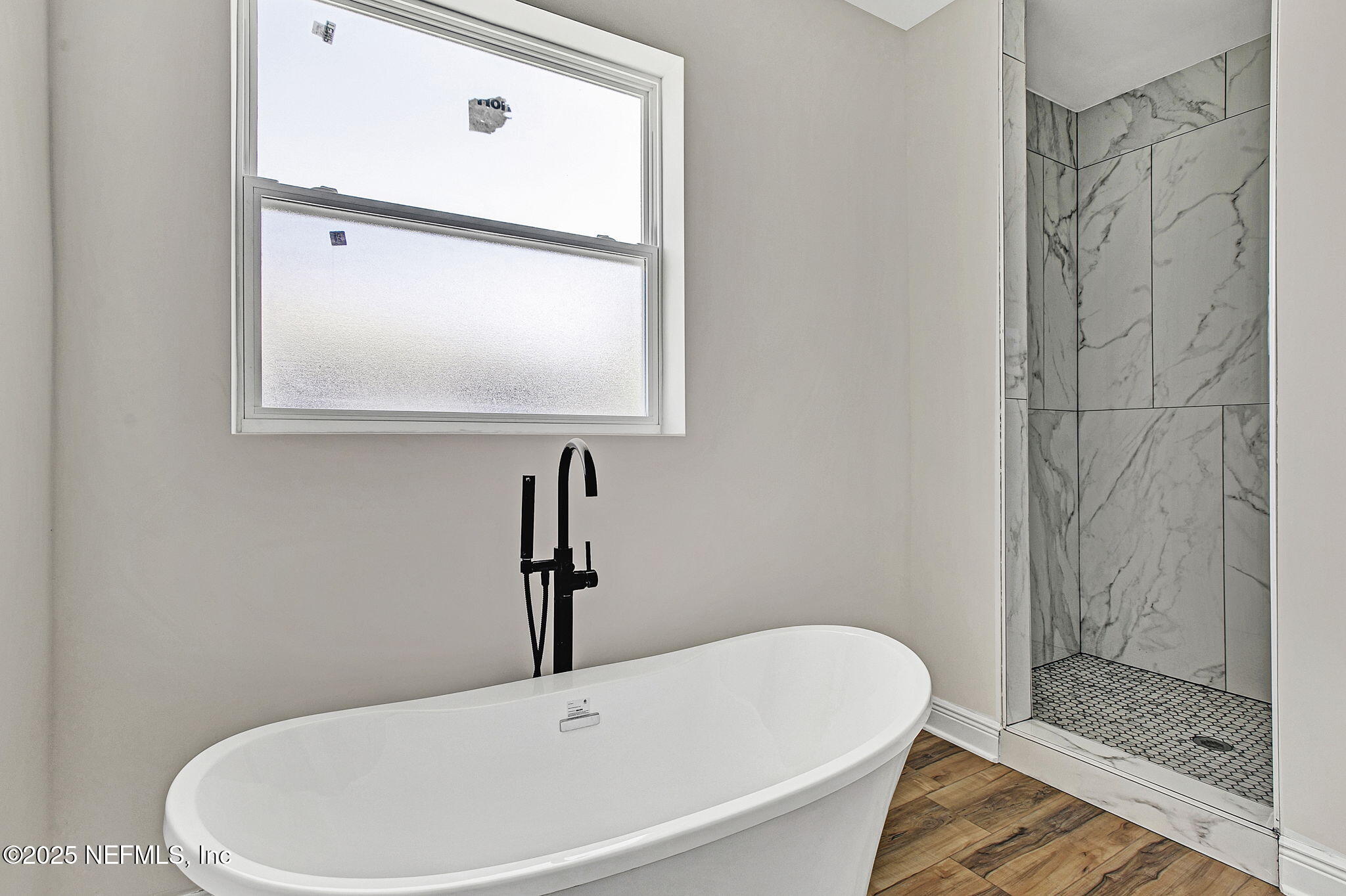 2841 Post Street Jacksonville, FL 32205 - Photo 26 of 40 a white bath tub sitting next to a shower