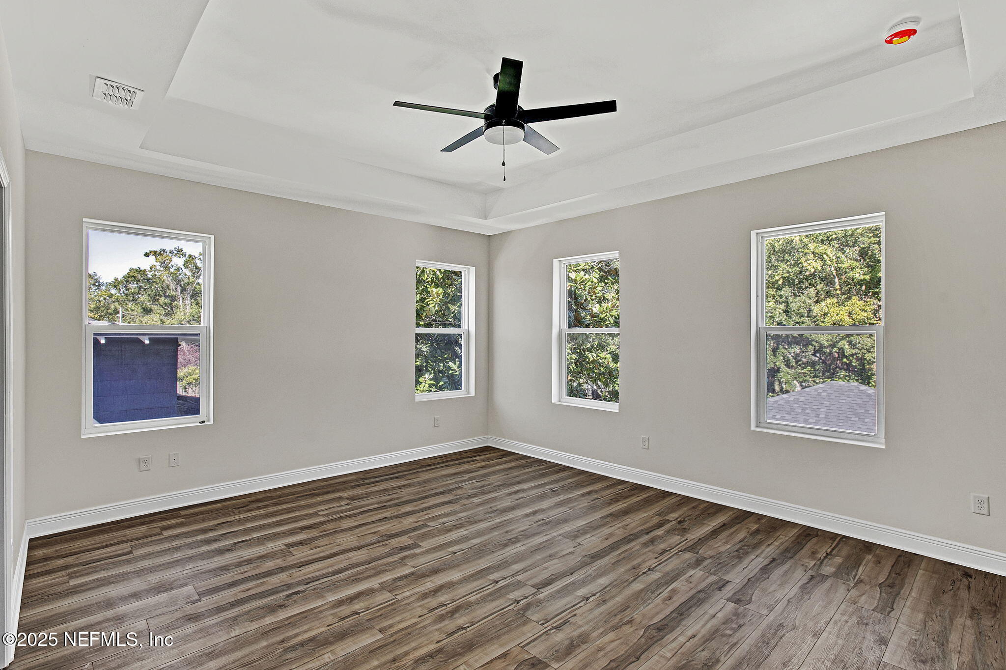 2841 Post Street Jacksonville, FL 32205 - Photo 29 of 40 a view of empty room with wooden floor and fan