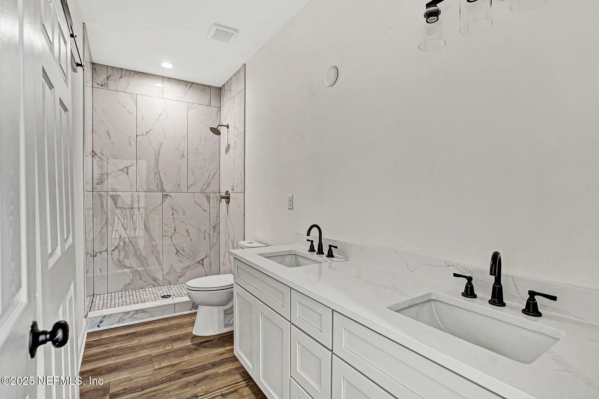 2841 Post Street Jacksonville, FL 32205 - Photo 30 of 40 a bathroom with a double vanity sink toilet and shower