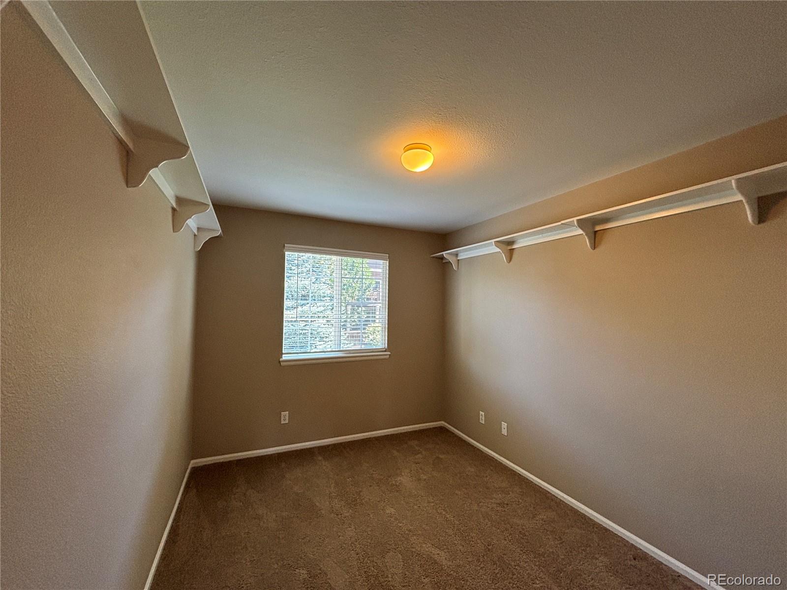 1281 Riddlewood Road Highlands Ranch, CO 80129 - Photo 20 of 27 a view of an empty room with a window