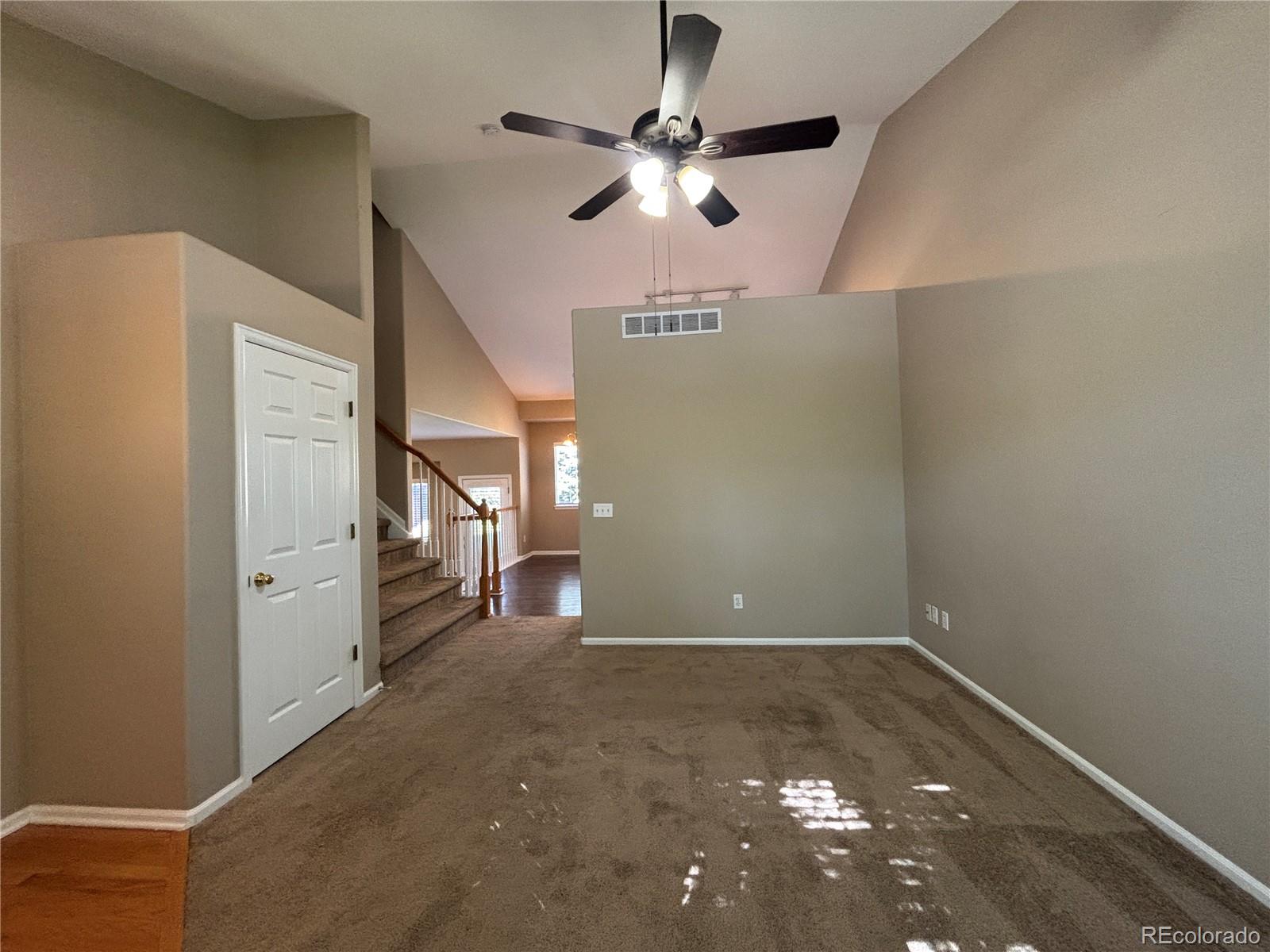 1281 Riddlewood Road Highlands Ranch, CO 80129 - Photo 4 of 27 a view of a livingroom with a ceiling fan and window