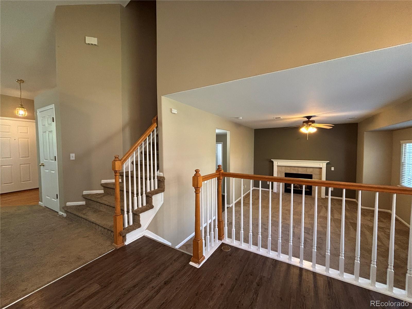 1281 Riddlewood Road Highlands Ranch, CO 80129 - Photo 8 of 27 a view of staircase with railing and a rug