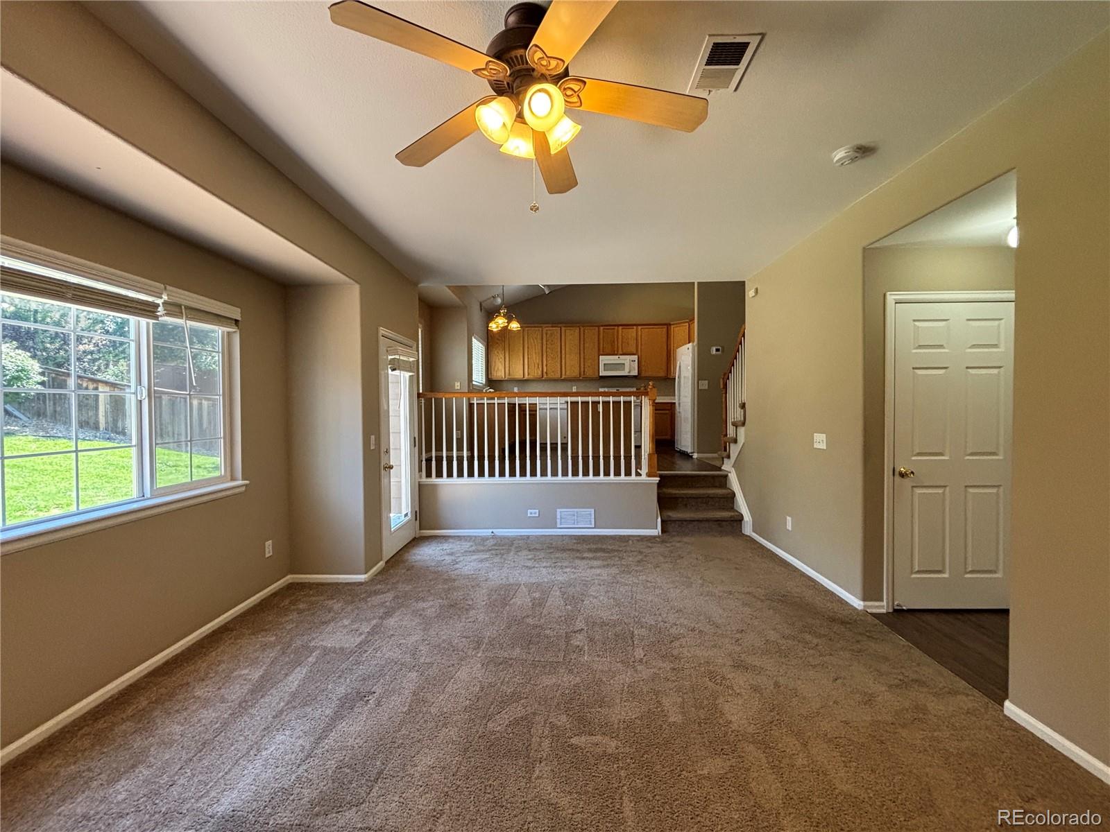 1281 Riddlewood Road Highlands Ranch, CO 80129 - Photo 10 of 27 wooden floor in an empty room with a window