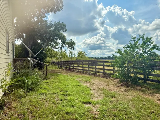a backyard of a house with lots of green space