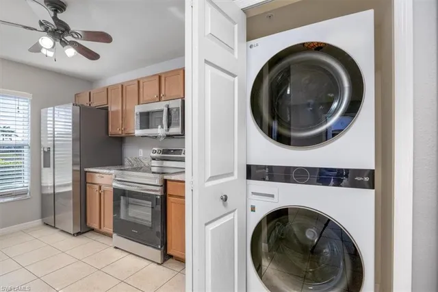 a view of a kitchen with washer and dryer