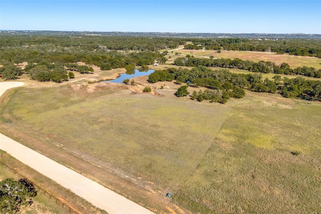 1074 Cornerstone Road Poolville, TX 76487 - Photo 1 of 10 a view of an ocean and beach