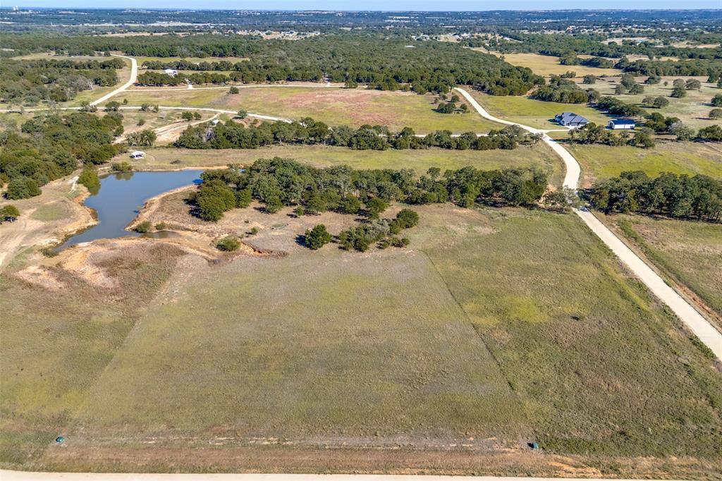 1074 Cornerstone Road Poolville, TX 76487 - Photo 3 of 10 a view of a city with an ocean view