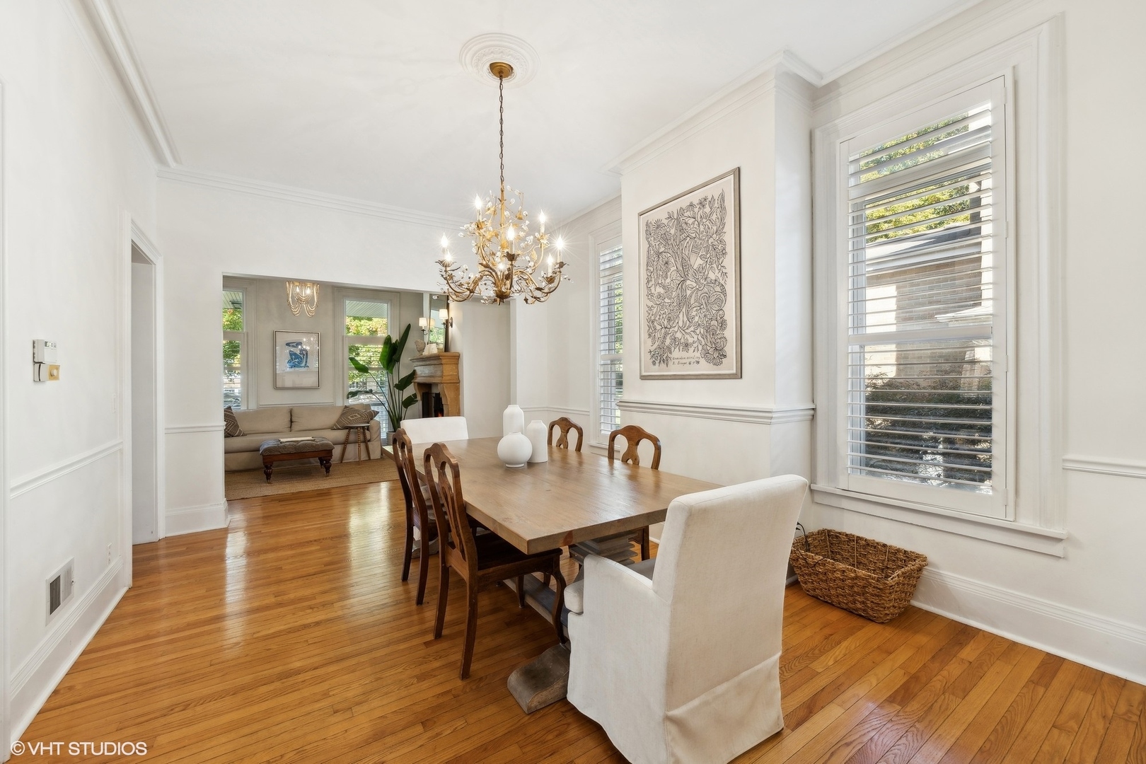 129 Barrypoint Road Riverside, IL 60546 - Photo 11 of 39 a dining room with furniture a chandelier and wooden floor