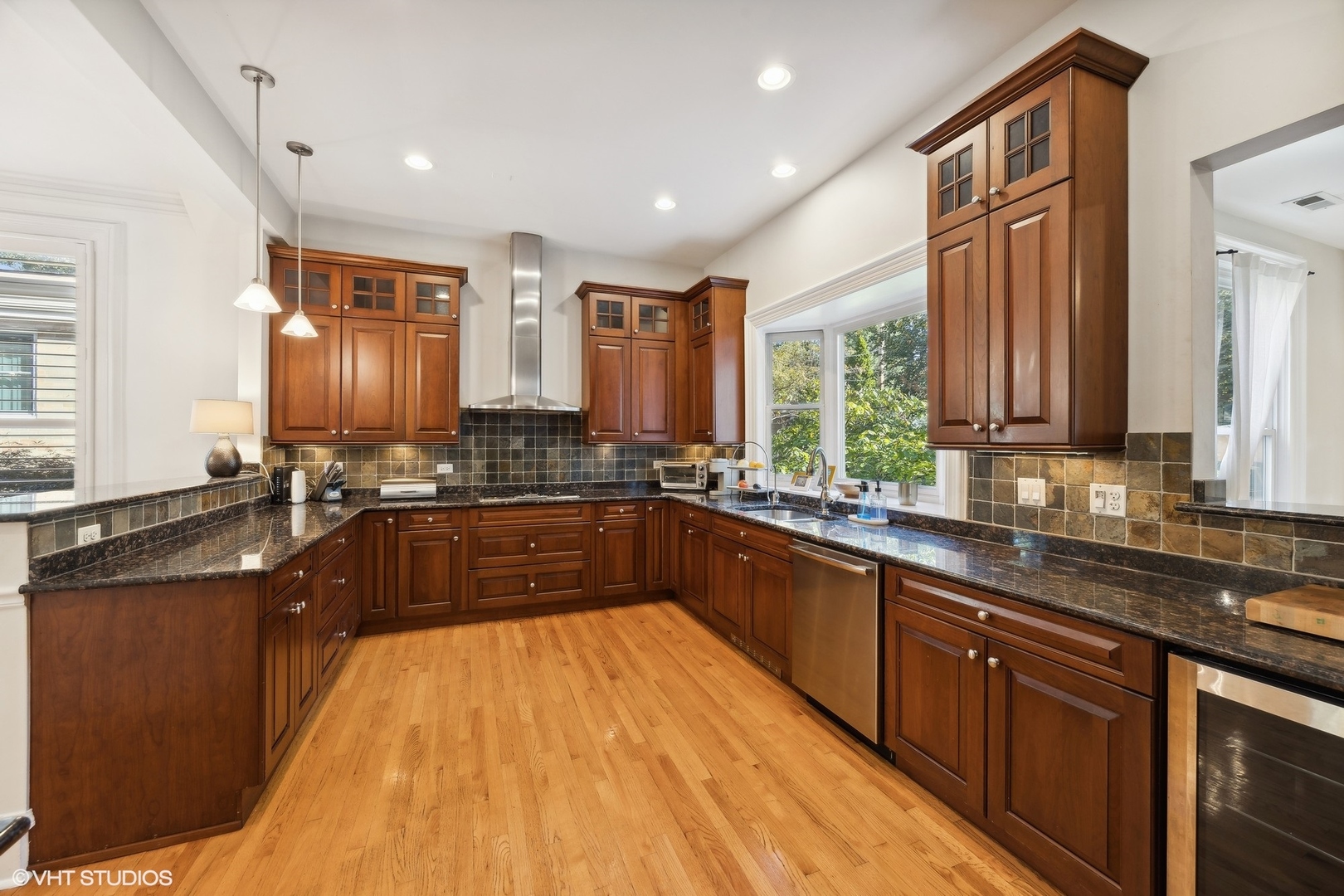 129 Barrypoint Road Riverside, IL 60546 - Photo 13 of 39 a large kitchen with granite countertop lots of counter space a sink and a window