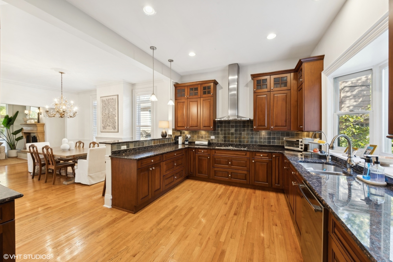 129 Barrypoint Road Riverside, IL 60546 - Photo 15 of 39 a large kitchen with kitchen island granite countertop a large counter top appliances and cabinets