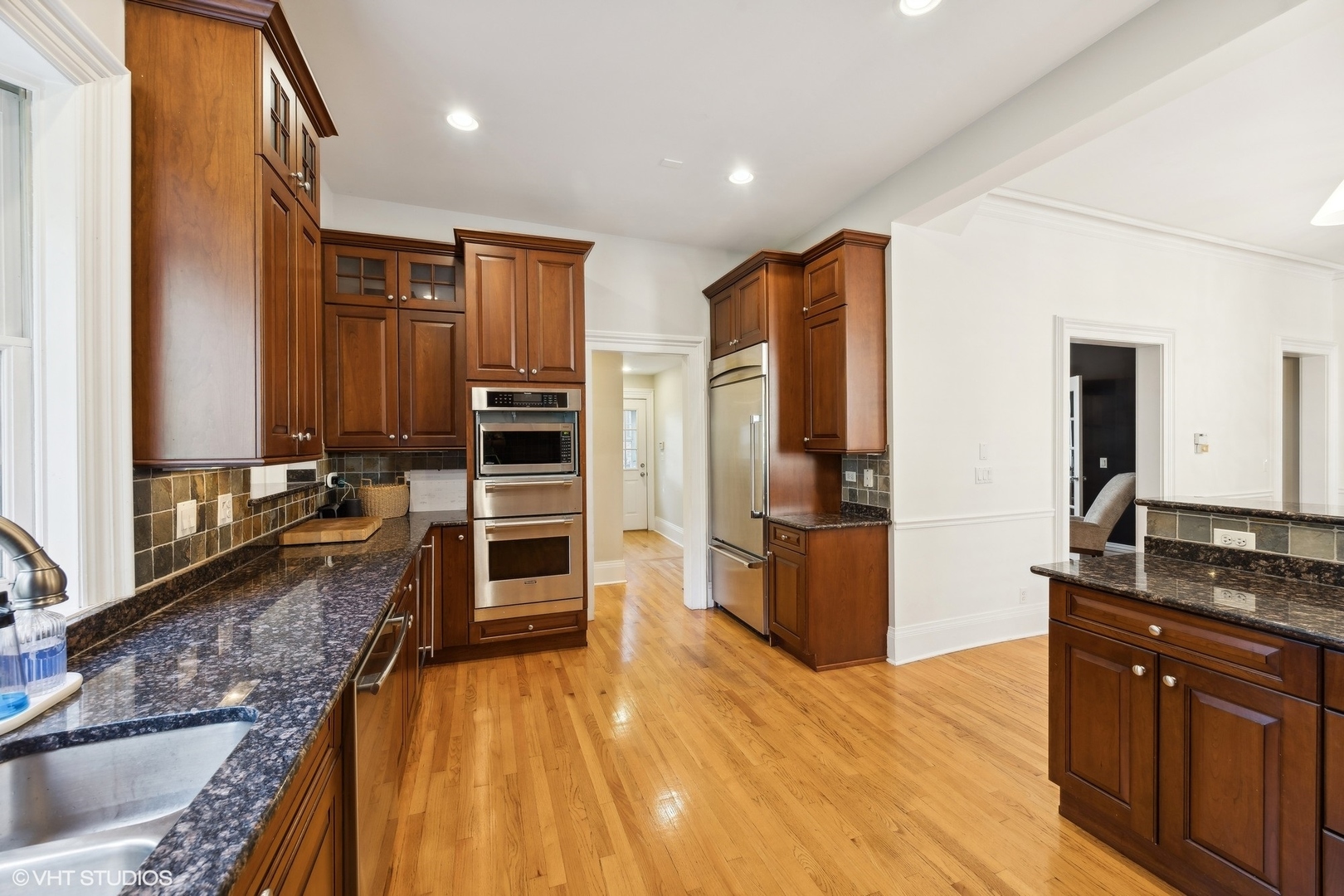 129 Barrypoint Road Riverside, IL 60546 - Photo 16 of 39 a kitchen with stainless steel appliances granite countertop a stove a sink and a refrigerator