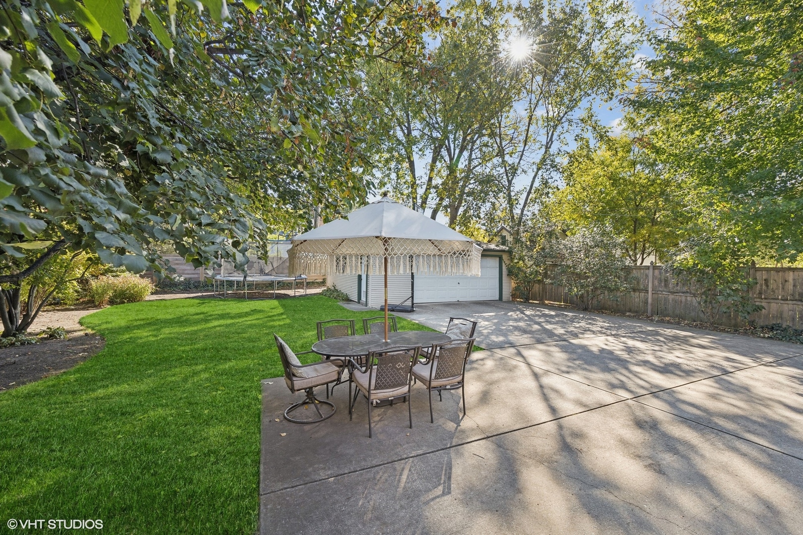 129 Barrypoint Road Riverside, IL 60546 - Photo 35 of 39 a backyard of a house with table and chairs