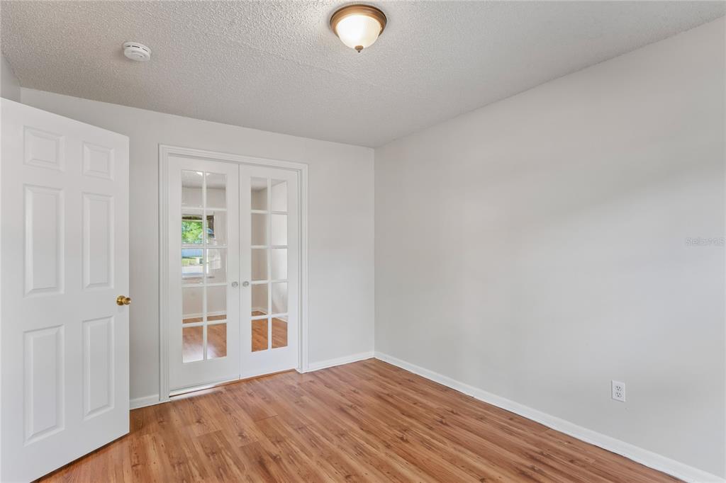 1907 Rambling Lane Brandon, FL 33510 - Photo 11 of 24 wooden floor in an empty room with a window