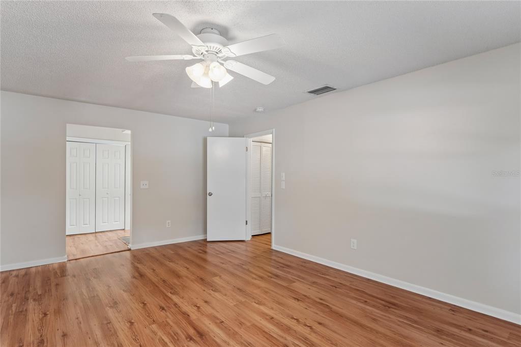 1907 Rambling Lane Brandon, FL 33510 - Photo 16 of 24 a view of an empty room with wooden floor