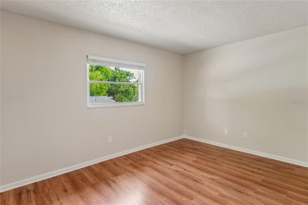 1907 Rambling Lane Brandon, FL 33510 - Photo 20 of 24 a view of empty room with wooden floor