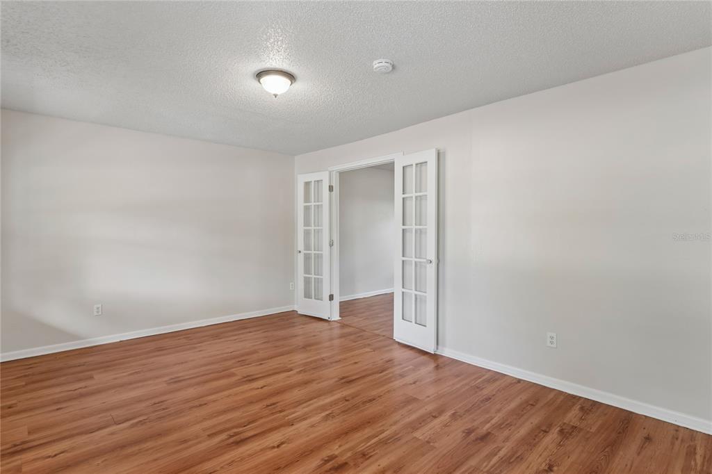 1907 Rambling Lane Brandon, FL 33510 - Photo 4 of 24 a view of an empty room with wooden floor