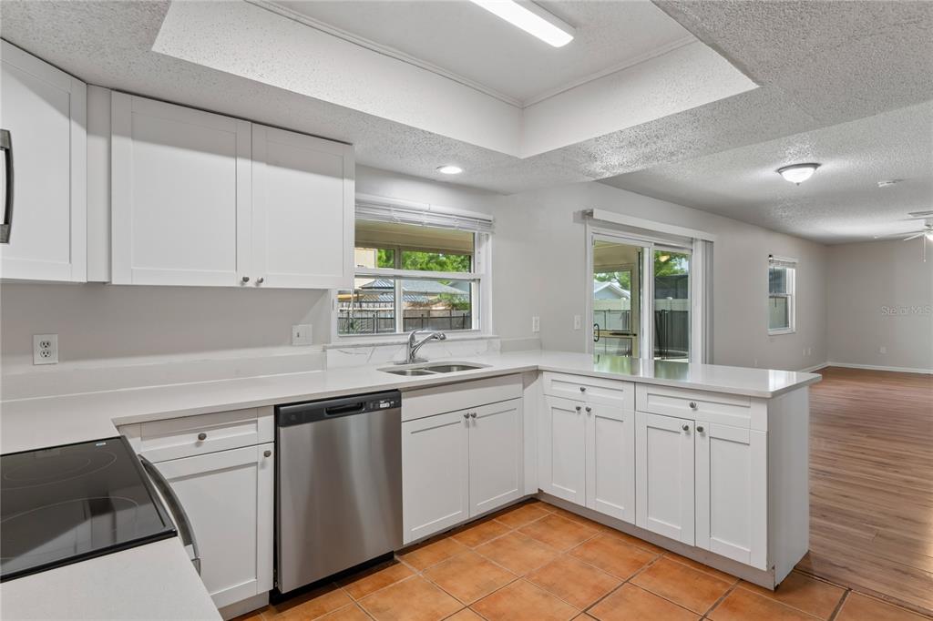 1907 Rambling Lane Brandon, FL 33510 - Photo 8 of 24 a kitchen with a sink stove and cabinets