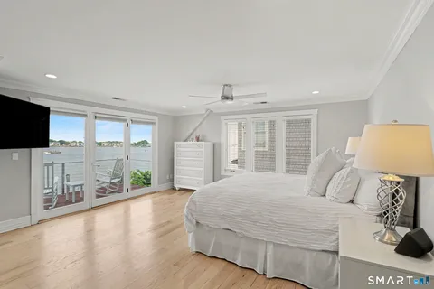 a view of a balcony with mountain view and wooden floor