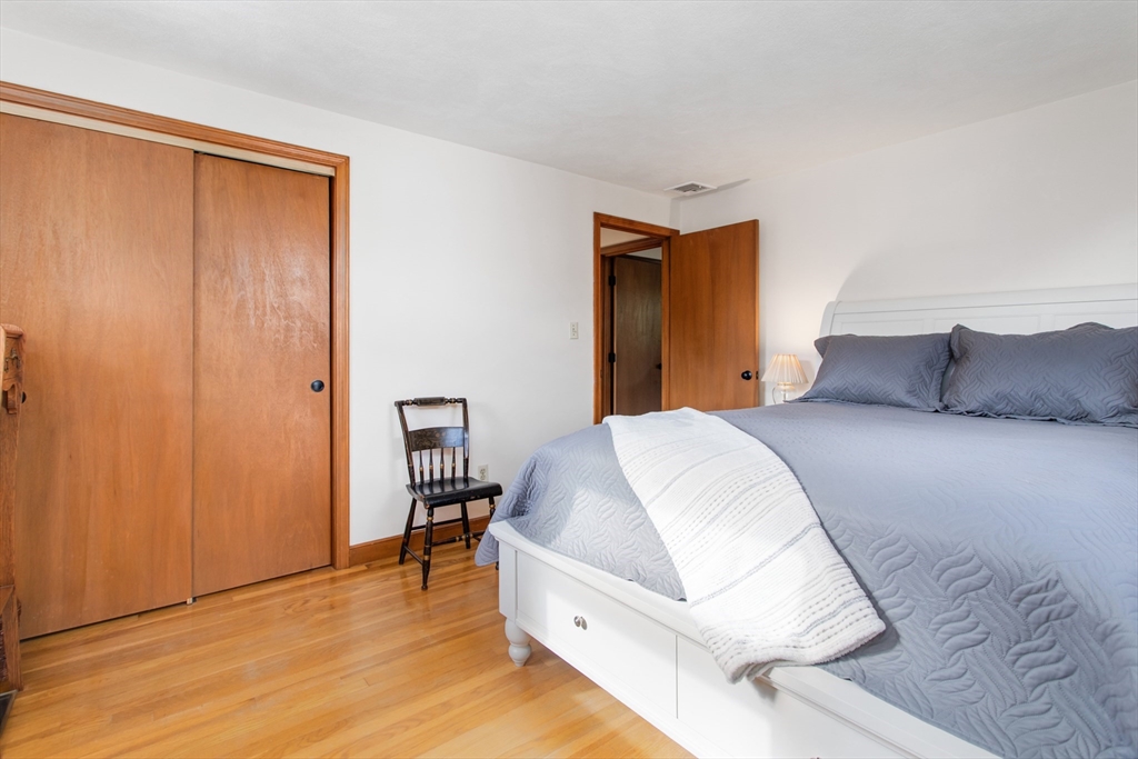 9 Hemlock Road Reading, MA 01867 - Photo 15 of 42 a bedroom with a bed and a table