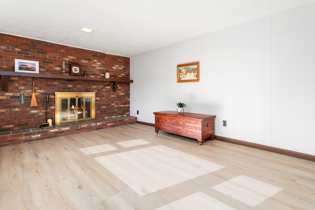 9 Hemlock Road Reading, MA 01867 - Photo 24 of 42 a room with a couch and a fireplace