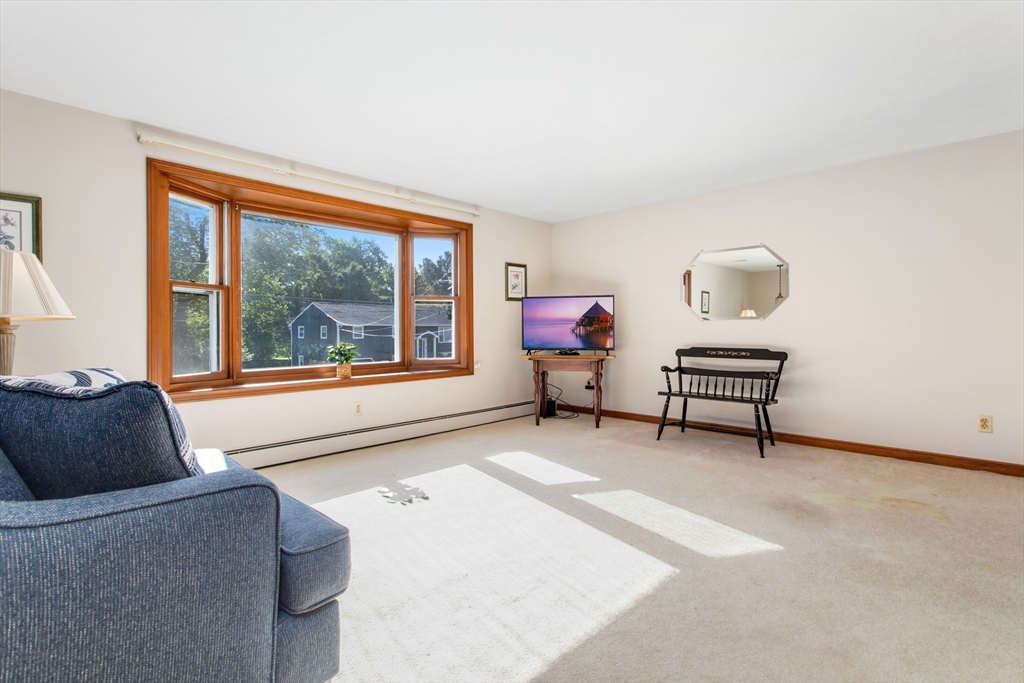 9 Hemlock Road Reading, MA 01867 - Photo 3 of 42 a living room with furniture and a window