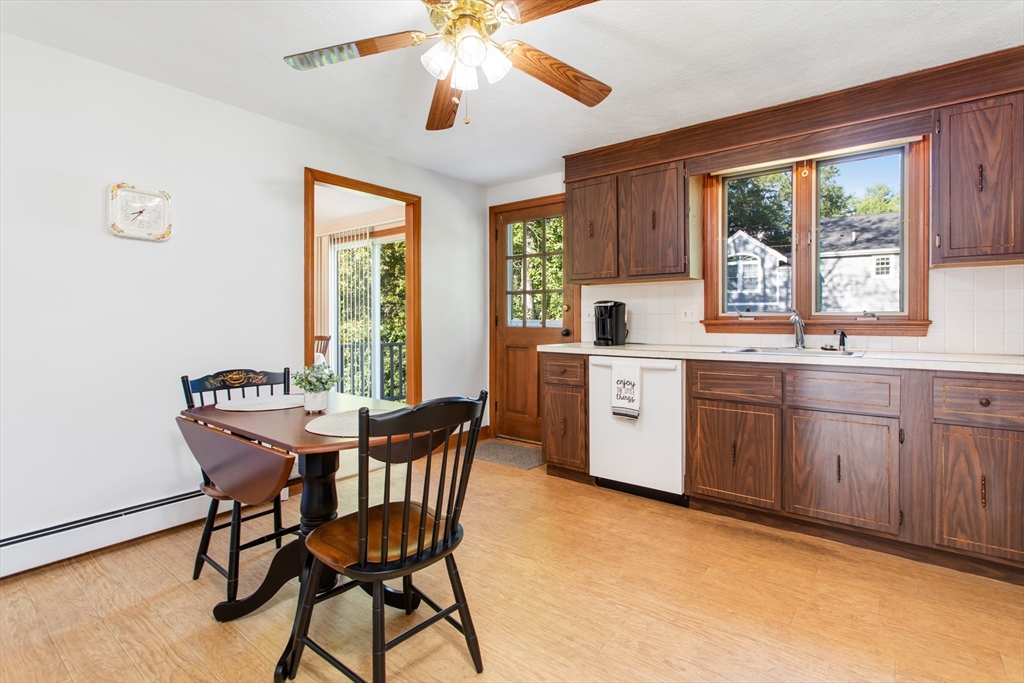 9 Hemlock Road Reading, MA 01867 - Photo 8 of 42 a view of a dining room with furniture window and outside view