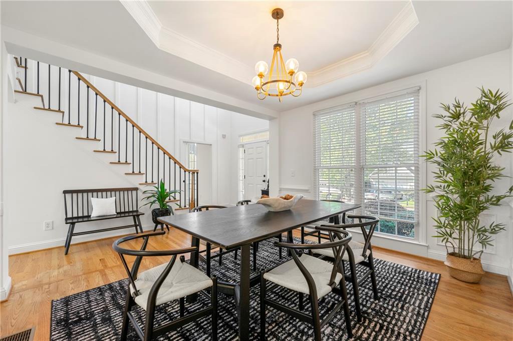 12579 Huntington Trace Alpharetta, GA 30005 - Photo 15 of 64 a view of a dining room with furniture window and wooden floor