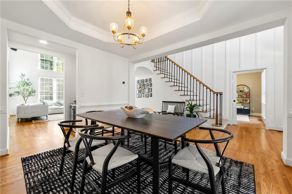 12579 Huntington Trace Alpharetta, GA 30005 - Photo 16 of 64 a view of a dining room with furniture and wooden floor