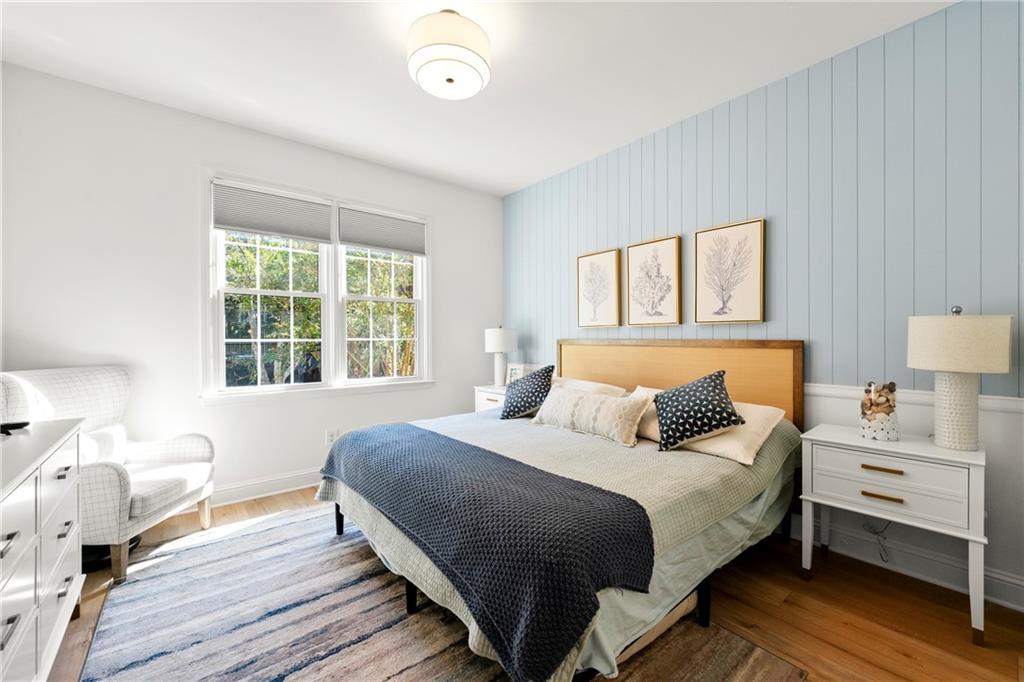 12579 Huntington Trace Alpharetta, GA 30005 - Photo 20 of 64 a bedroom with a bed and a large window