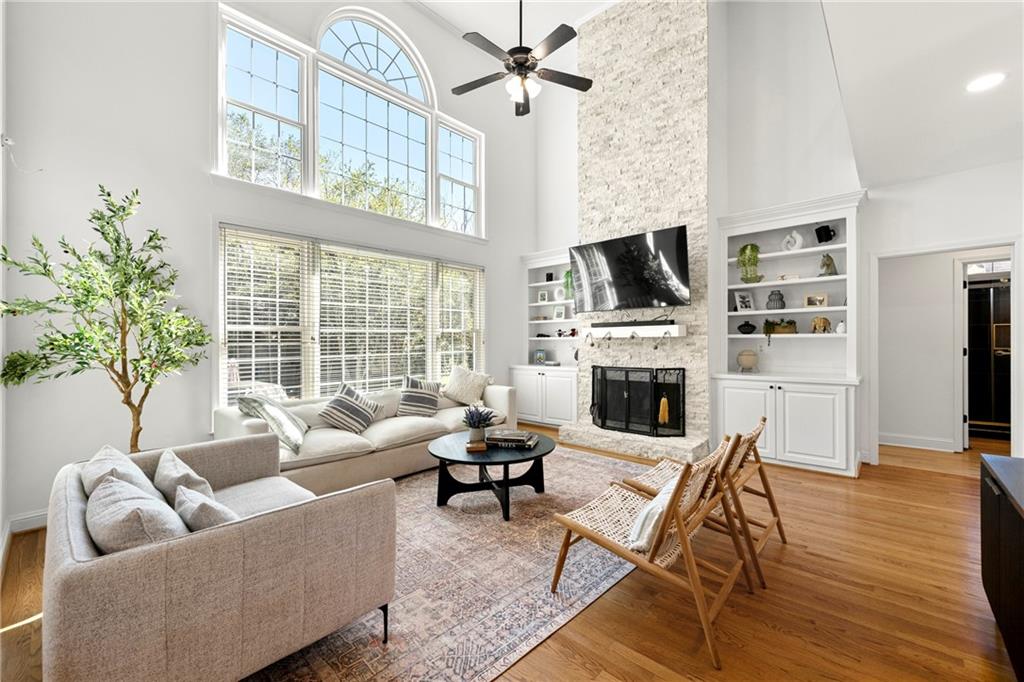 12579 Huntington Trace Alpharetta, GA 30005 - Photo 21 of 64 a living room with furniture fireplace and flat screen tv