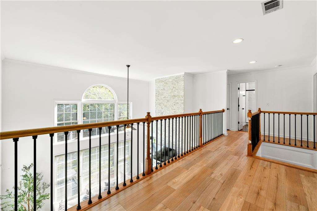 12579 Huntington Trace Alpharetta, GA 30005 - Photo 33 of 64 a view of staircase with wooden floor and fence