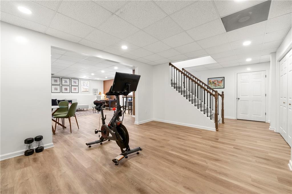 12579 Huntington Trace Alpharetta, GA 30005 - Photo 39 of 64 a view of a room with gym equipment and a window