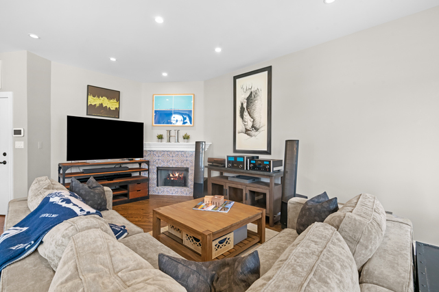 841 West Monroe Street, Unit 4A Chicago, IL 60607 - Photo 11 of 30 a living room with furniture and a flat screen tv
