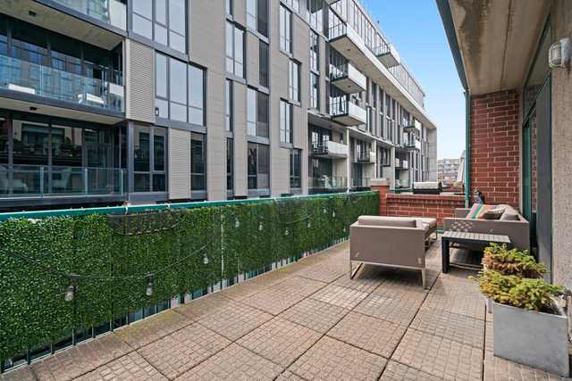 841 West Monroe Street, Unit 4A Chicago, IL 60607 - Photo 27 of 30 a backyard of a house with yard and outdoor seating