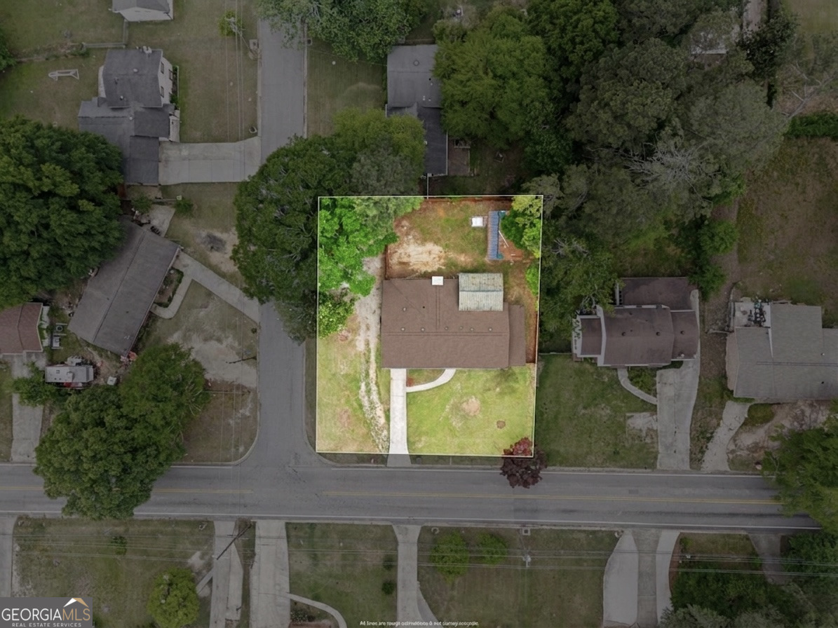 6463 Maddox Road Morrow, GA 30260 - Photo 46 of 46 an aerial view of a house with a yard