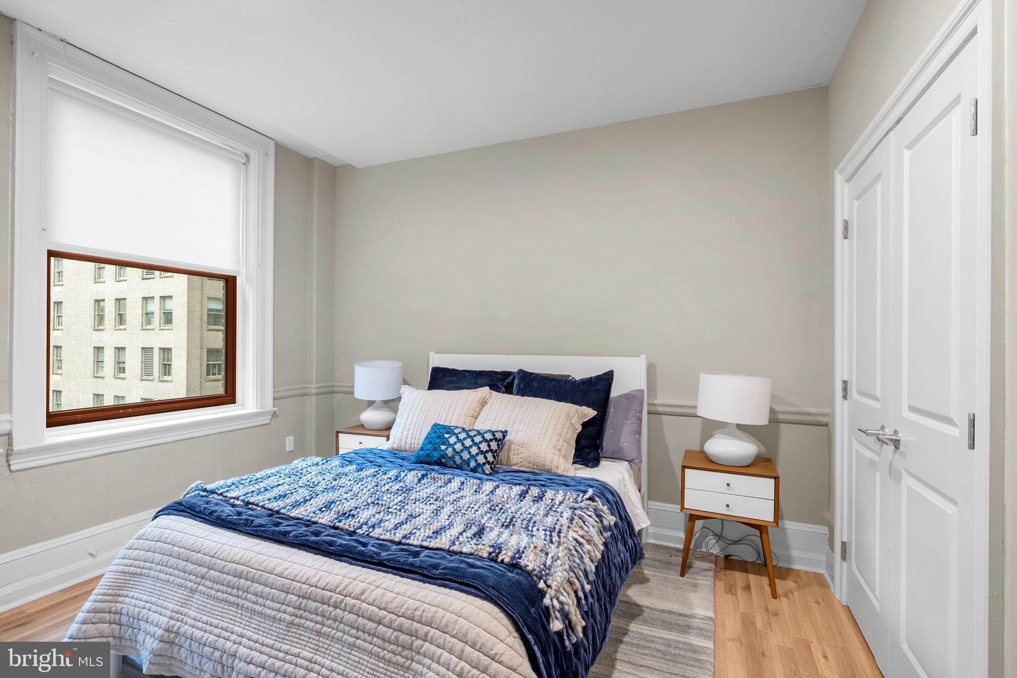 1420-22 Chestnut Street, Unit 301 Philadelphia, PA 19102 - Photo 12 of 29 a bedroom with a bed and a window