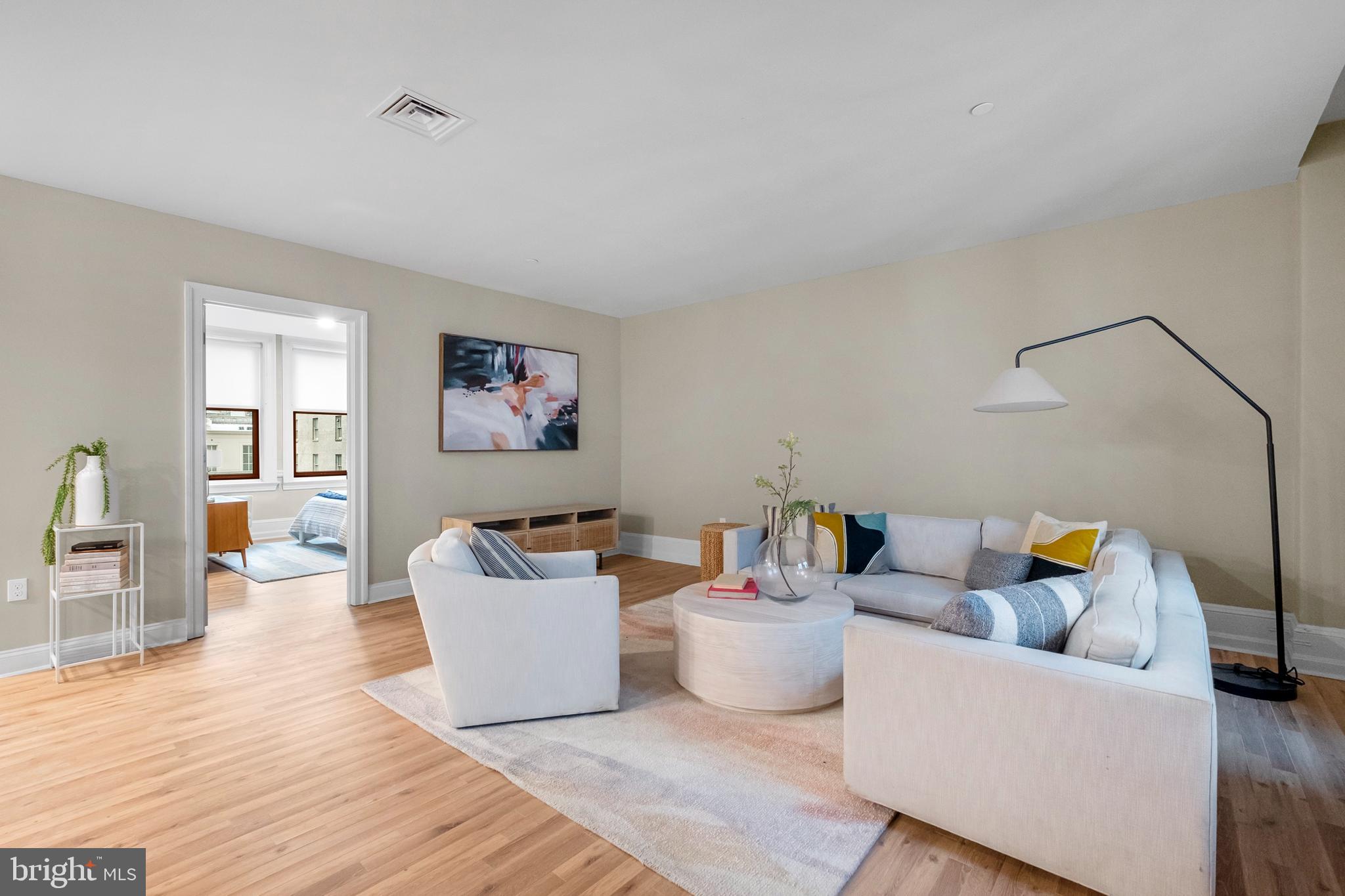 1420-22 Chestnut Street, Unit 301 Philadelphia, PA 19102 - Photo 3 of 29 a living room with furniture and wooden floor